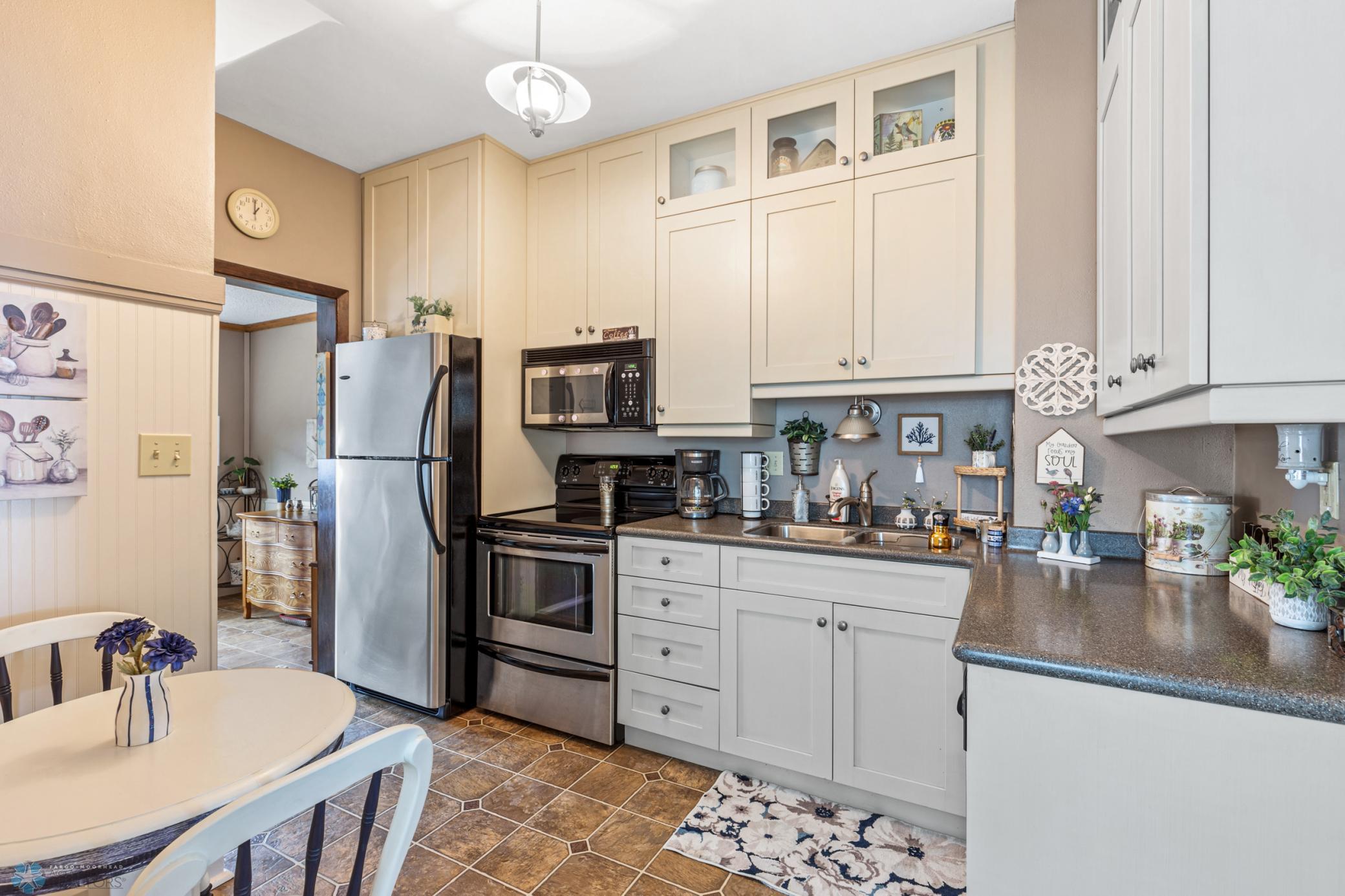 Kitchen- Stainless Steel Appliances & Corian Countertops