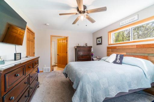 Another view of the primary bedroom with its own private bathroom and walk in closet