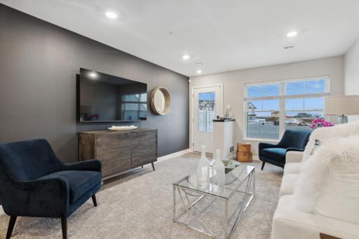The home welcomes you and your family and guests with a bright entrance leading directly into the main floor great room. There is a large media wall which offers a ton of space, large windows & the layout is very comfortable.