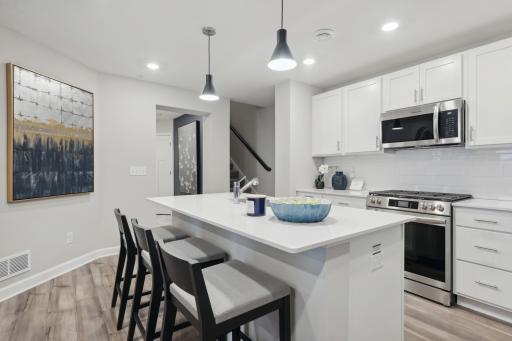 There is convenient access to the 2 car garage through a hallway that extends from the kitchen into a mudroom. Perfect location for bringing in groceries and for kids to drop off their backpacks and shoes!
