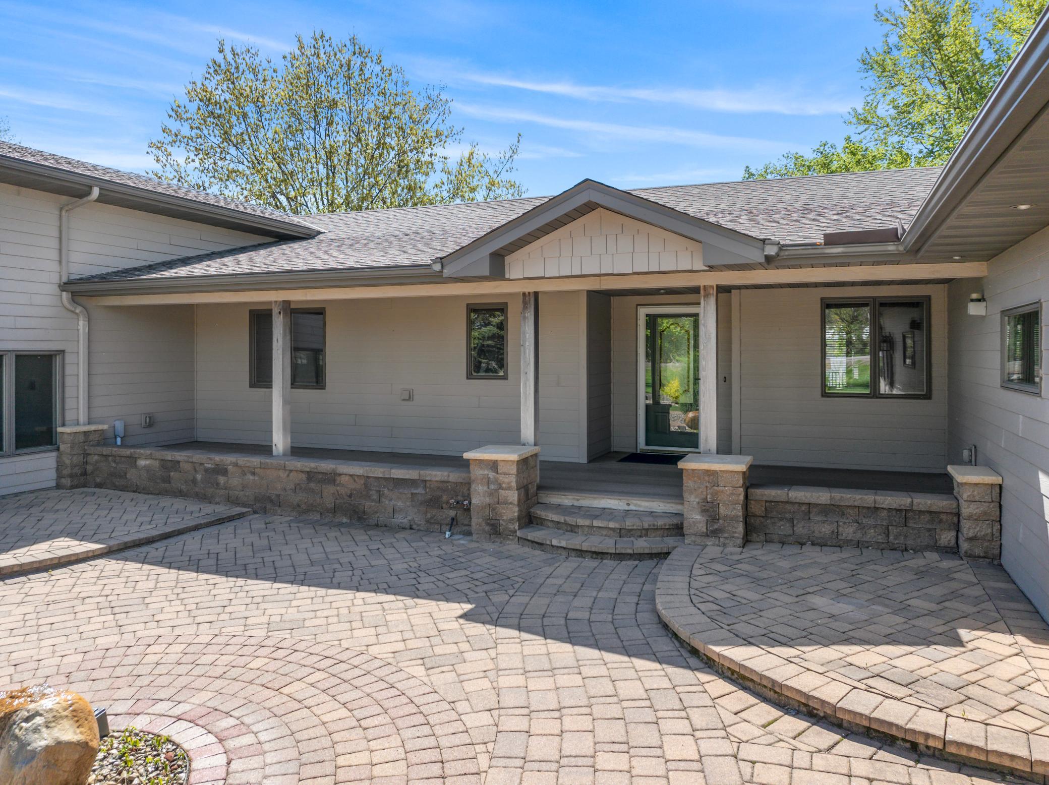 Beautiful Paver Patio and Walkway up to a Covered Front Porch