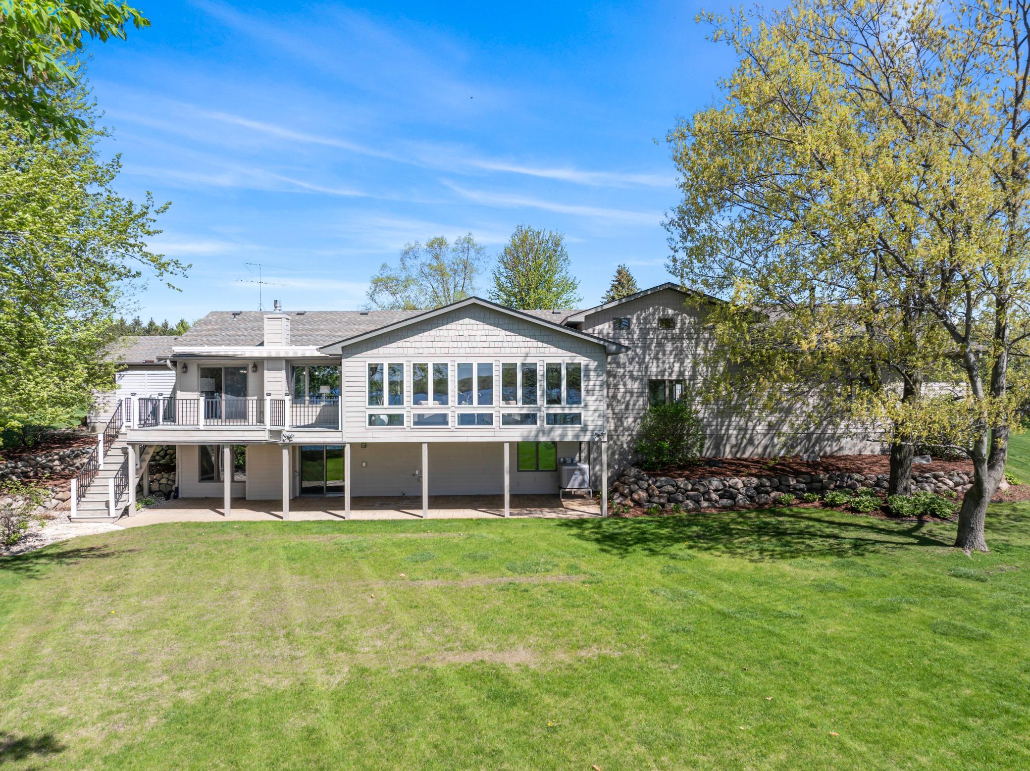 Back View of the Home Showing off All Those Windows Overlooking the Lake.