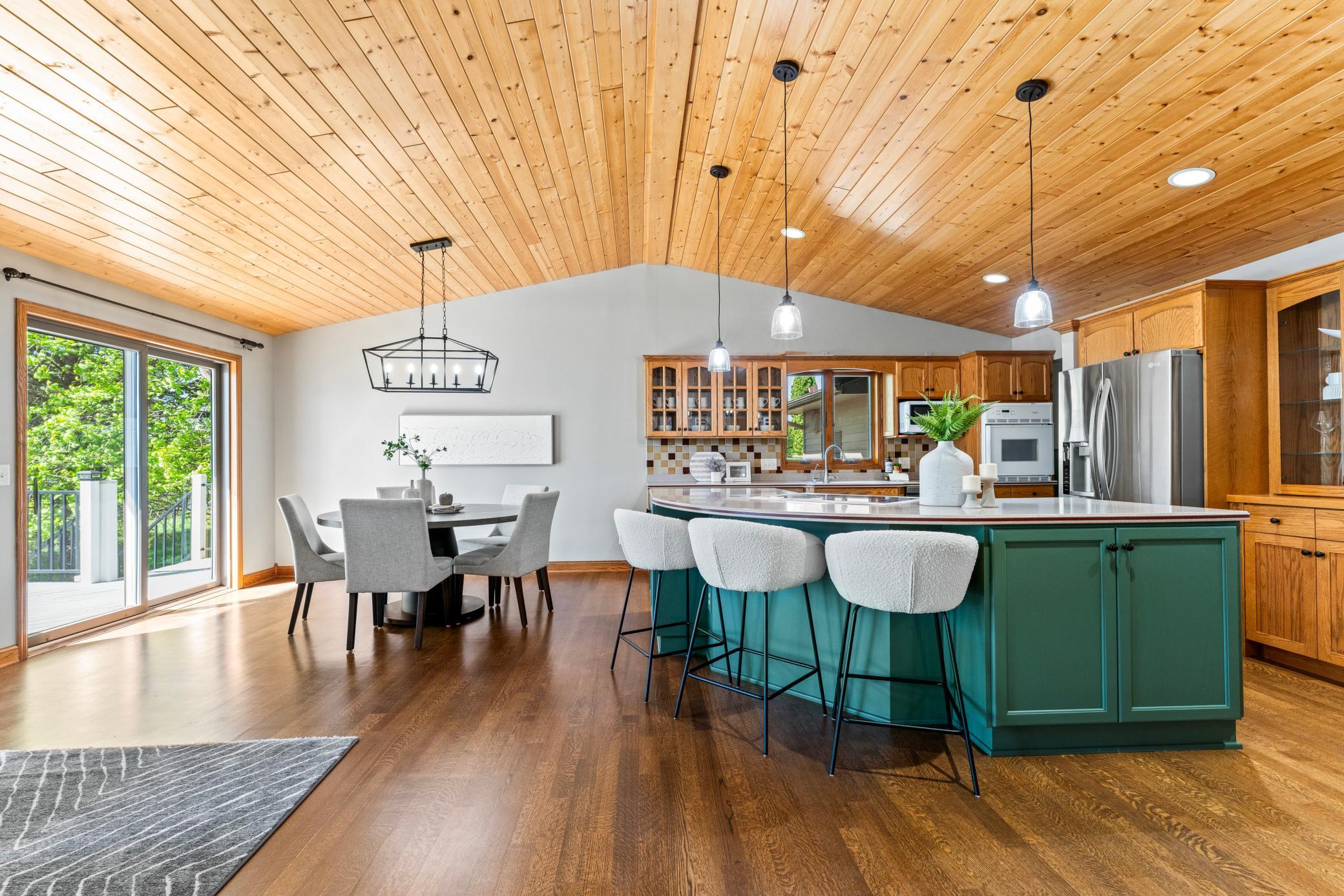 Notice the Beautiful Oak Flooring and Vaulted Pine Ceiling. New Lighting too!