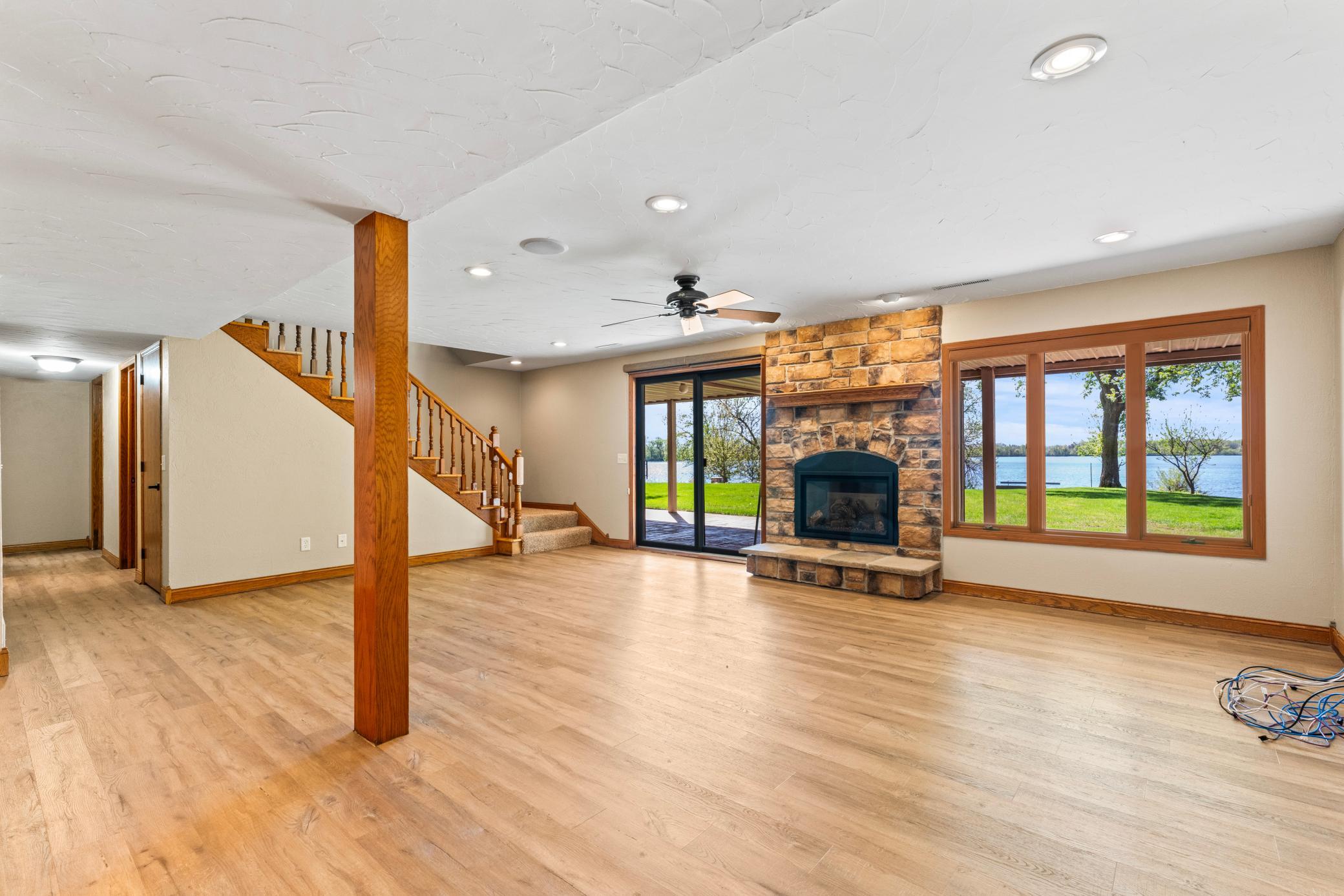 Lower Level Family Room Walks Out to the Back Yard and Lake