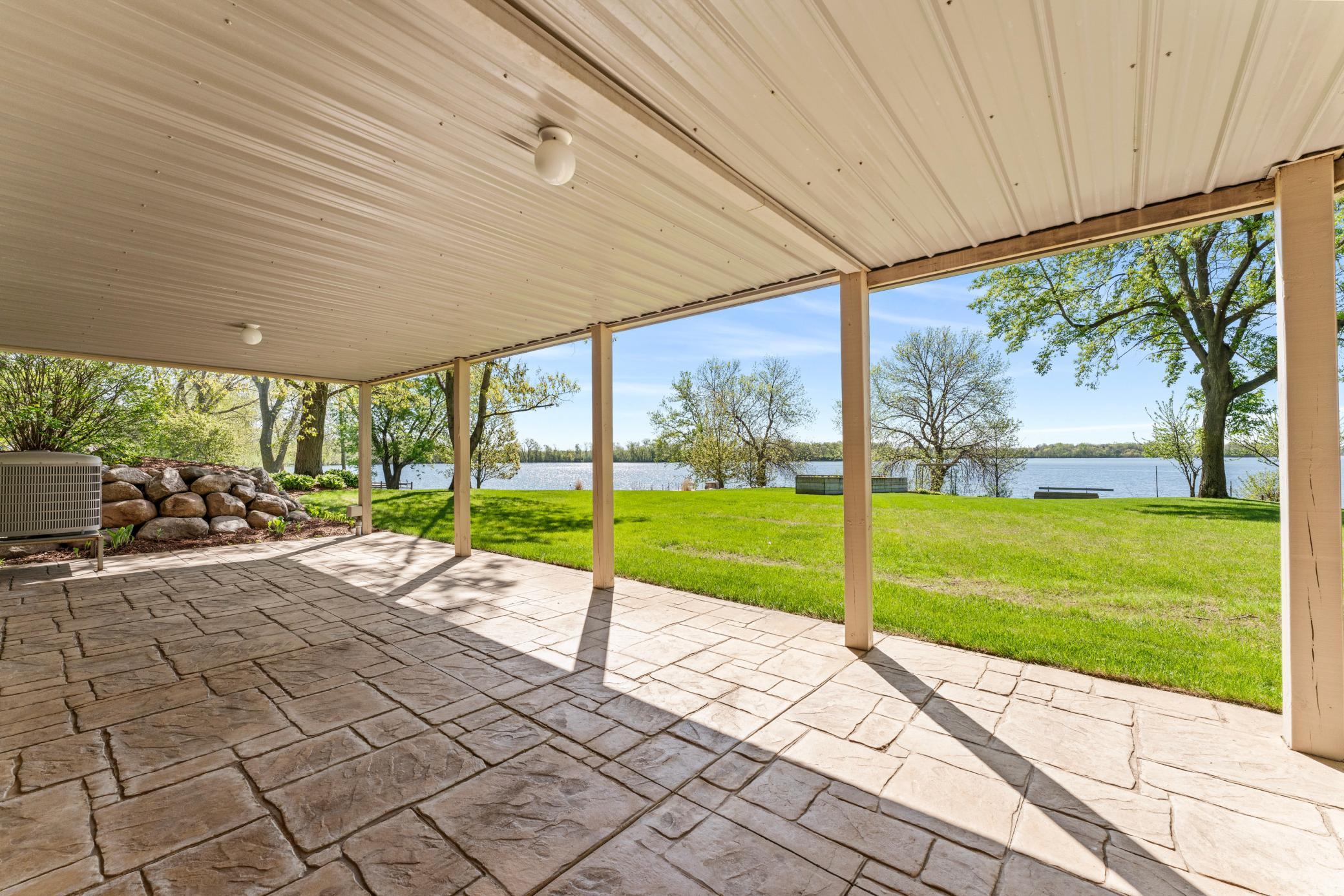 Beautiful Lower Level Stamped Concrete Patio with Lighted Under Deck Gutter System
