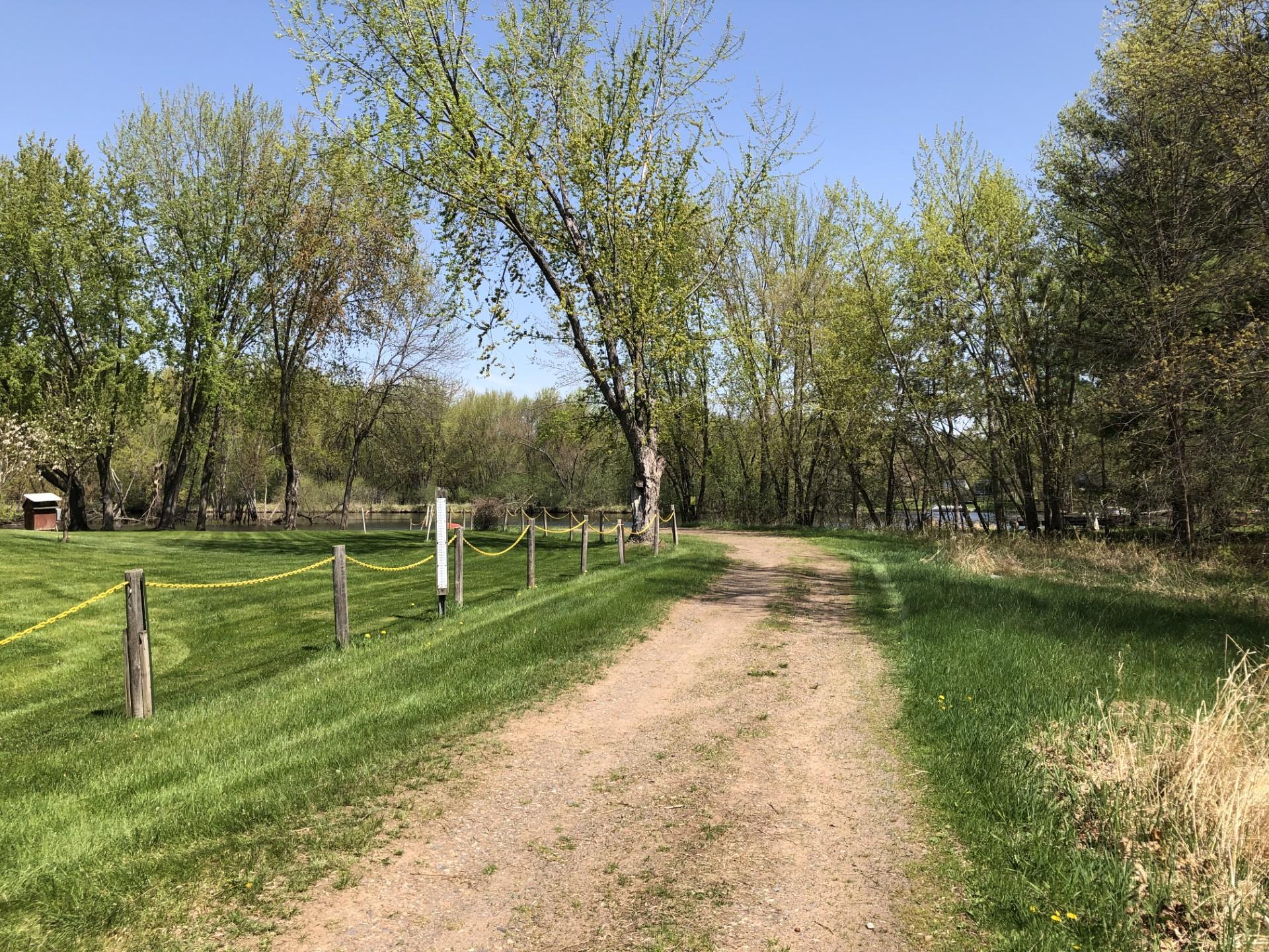 This is the road past the chain gate leading to the river/boat launch.