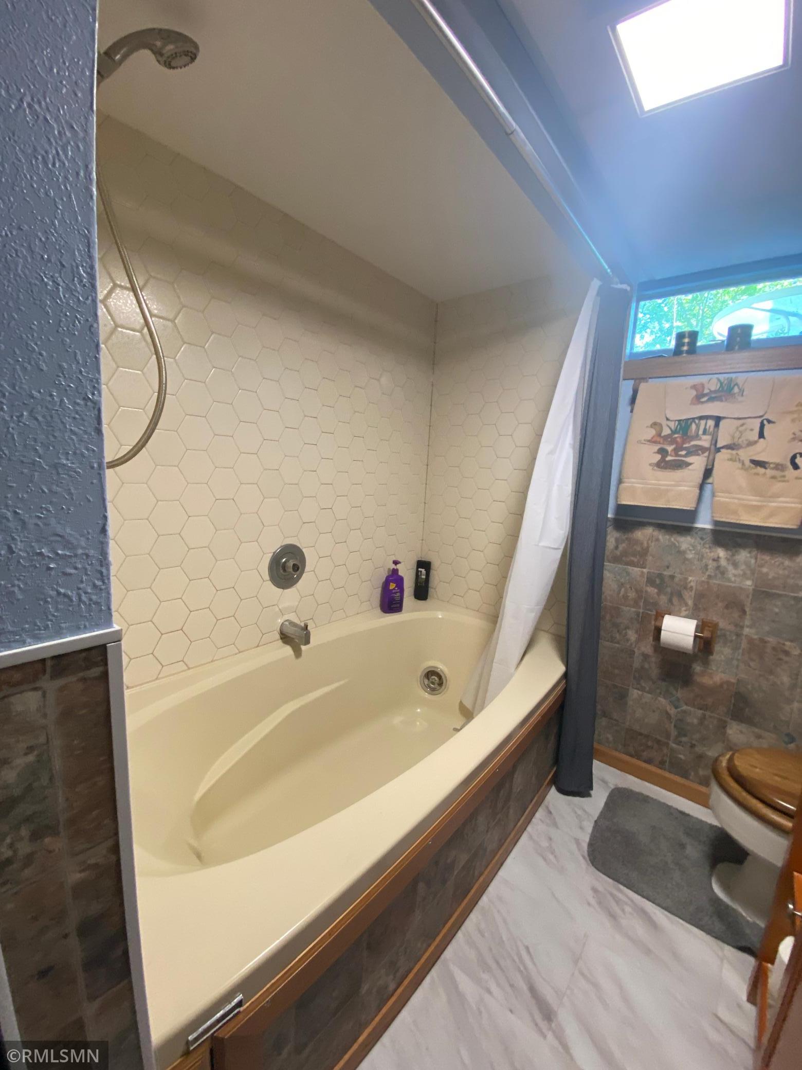 Lower level jacuzzi tub