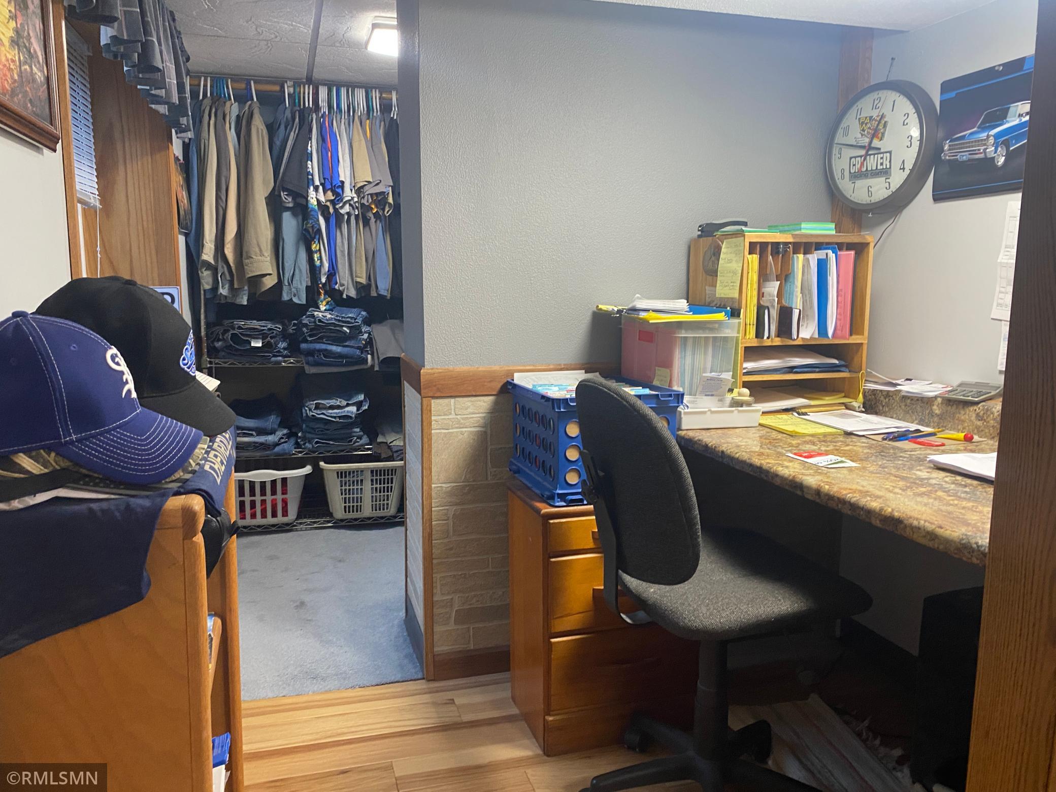 Dressing area with walk in closet in lower area