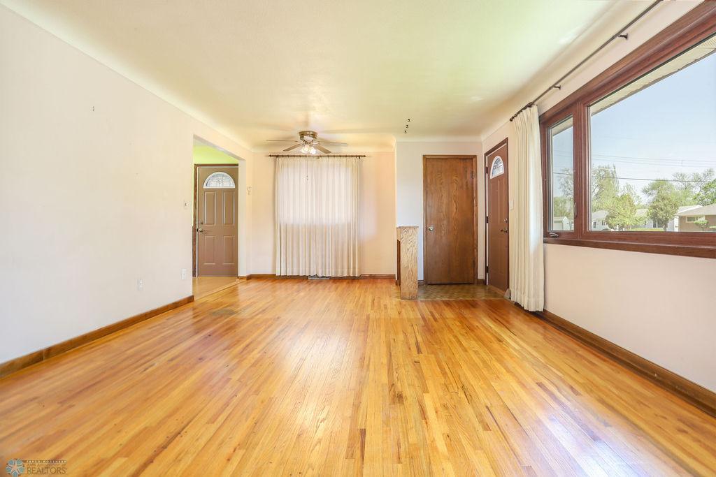Living room looking to entry & dining space
