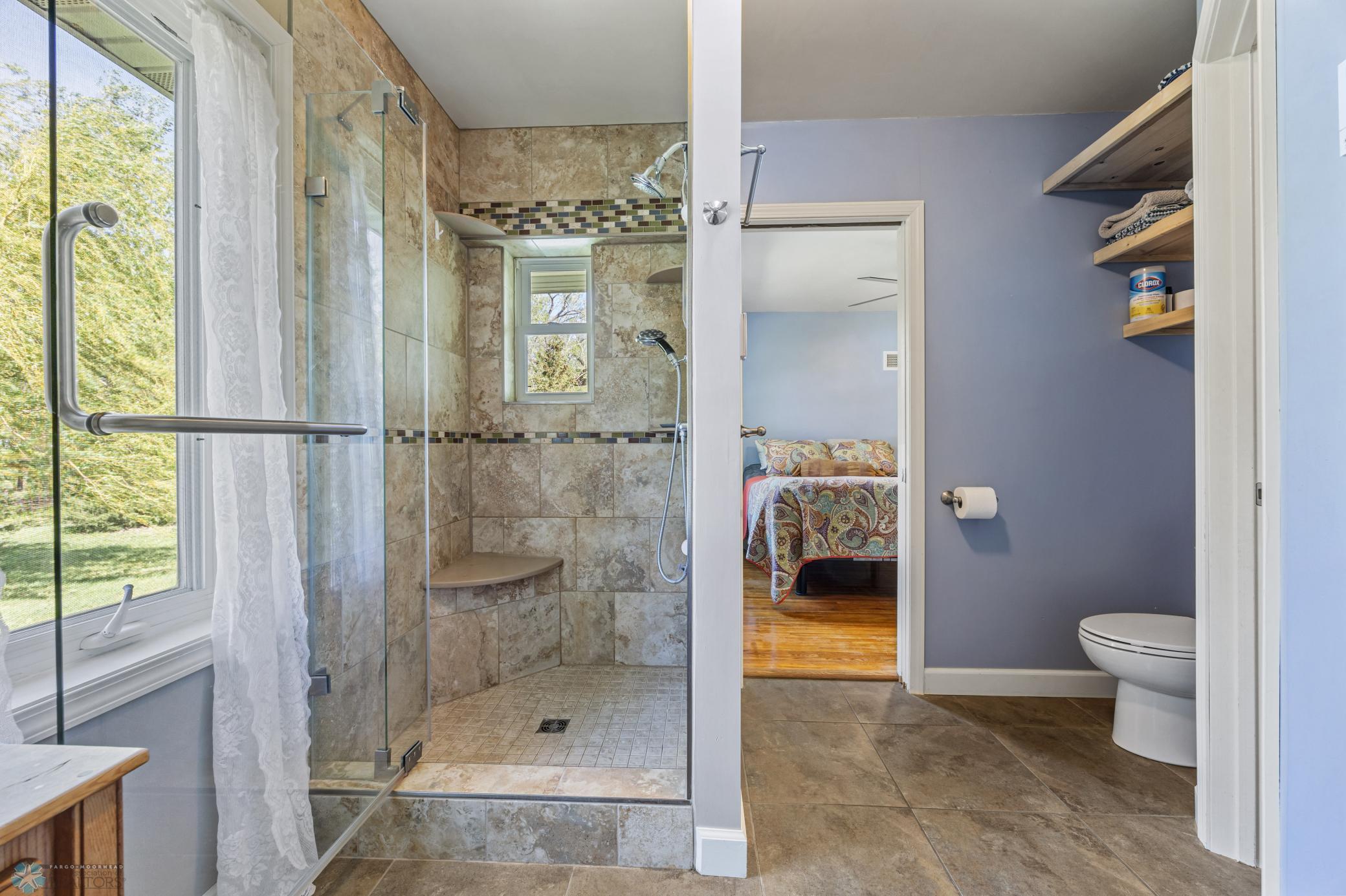 Primary electronic shower with heated bench and floor