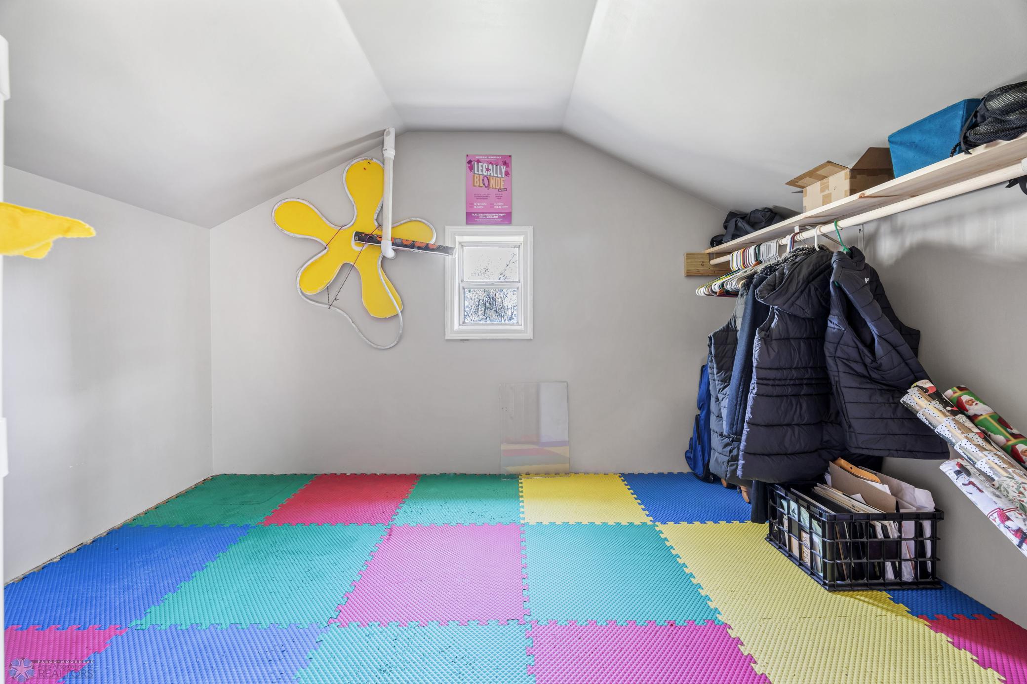 Insulated storage in loft space next to stairs