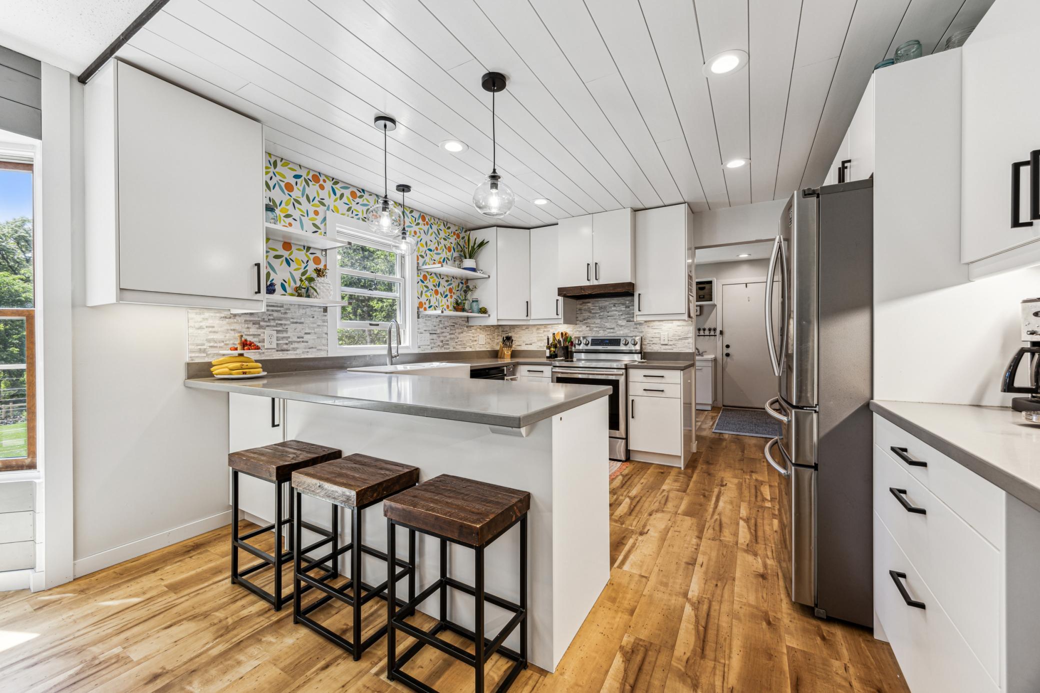 The spacious eat-in kitchen features a convenient breakfast bar for quick meals and plenty of countertop space for preparing larger dishes.