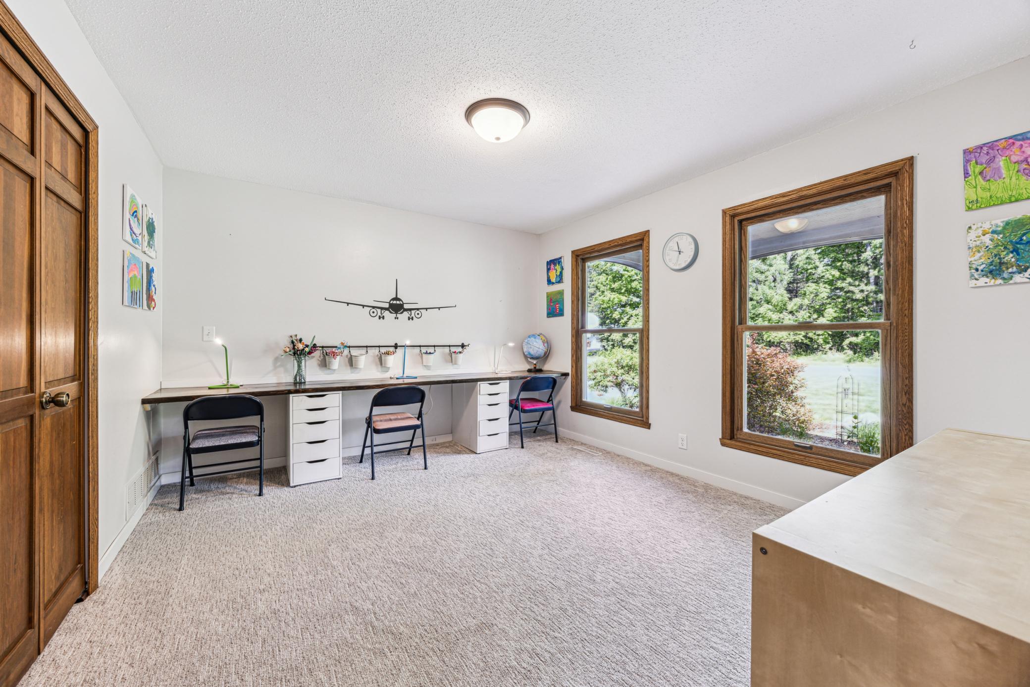 The main-level bedroom offers a comfortable retreat, ideal for those who prefer to avoid stairs.