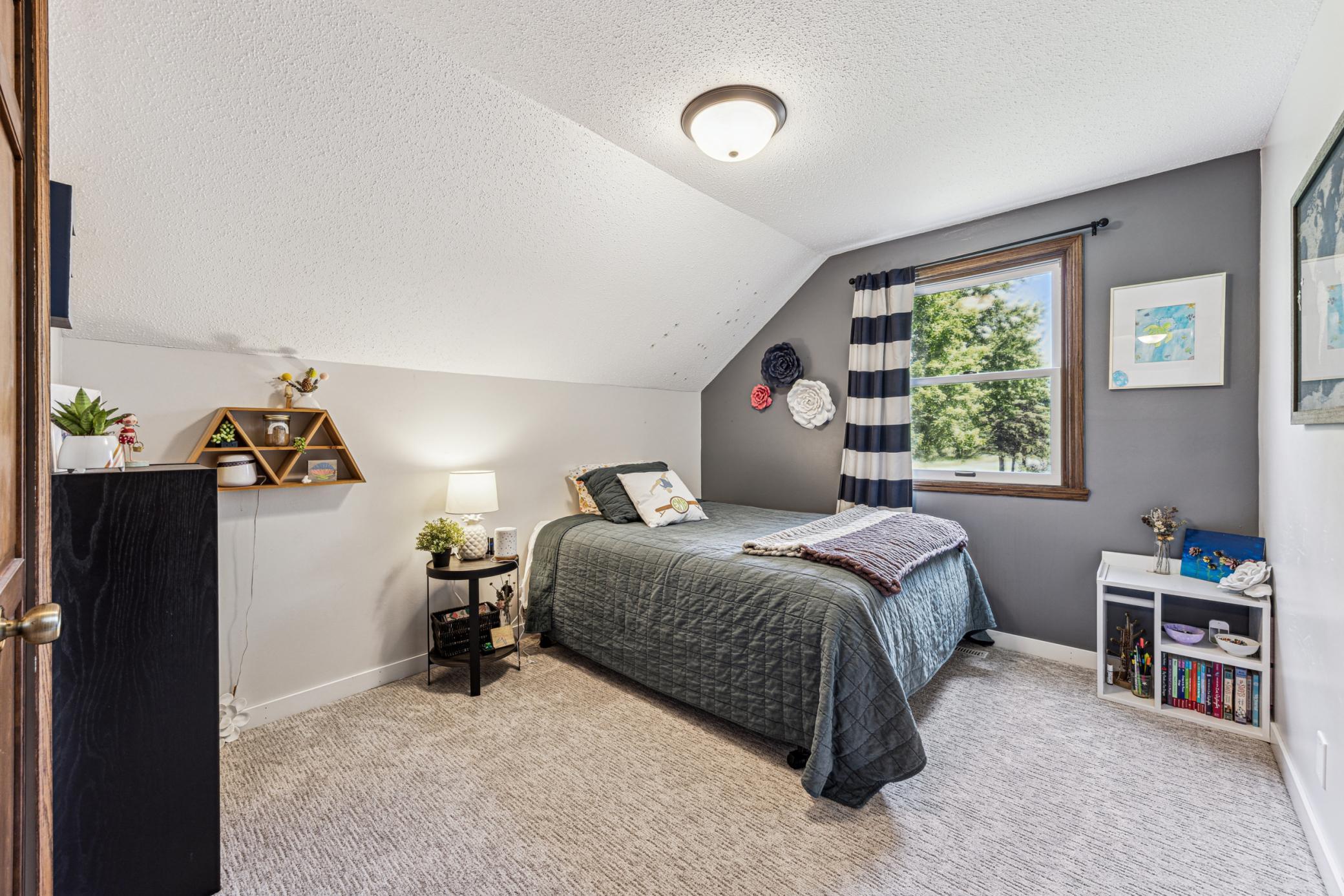 Bathed in morning light, the third upper-level bedroom faces east, great for early risers.