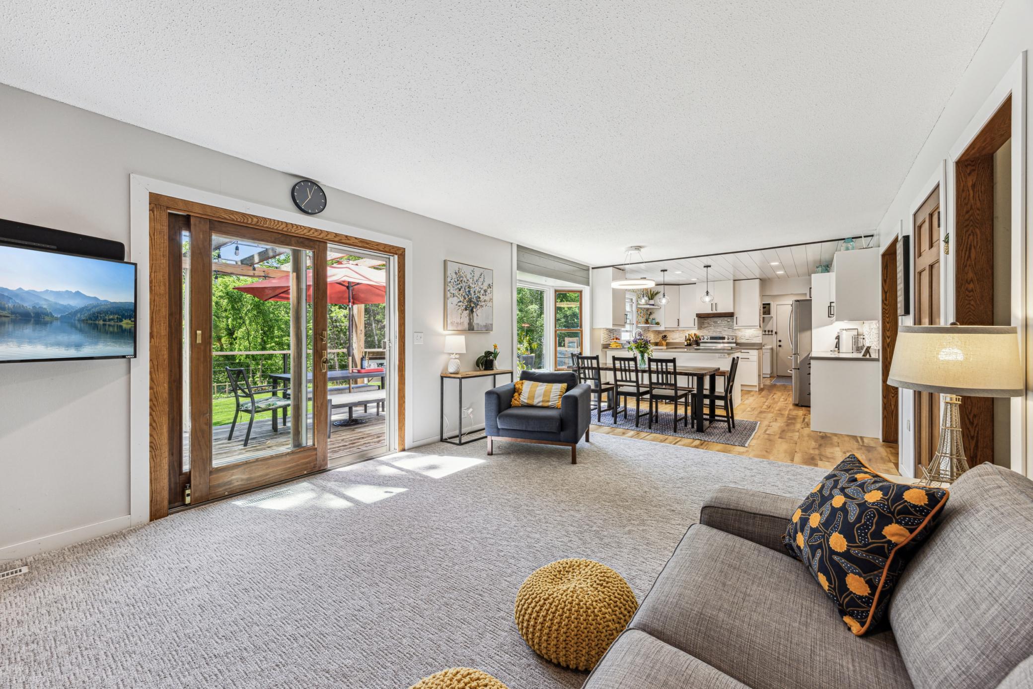 A seamless transition from the living room to the kitchen creates an open layout that makes conversation easy.