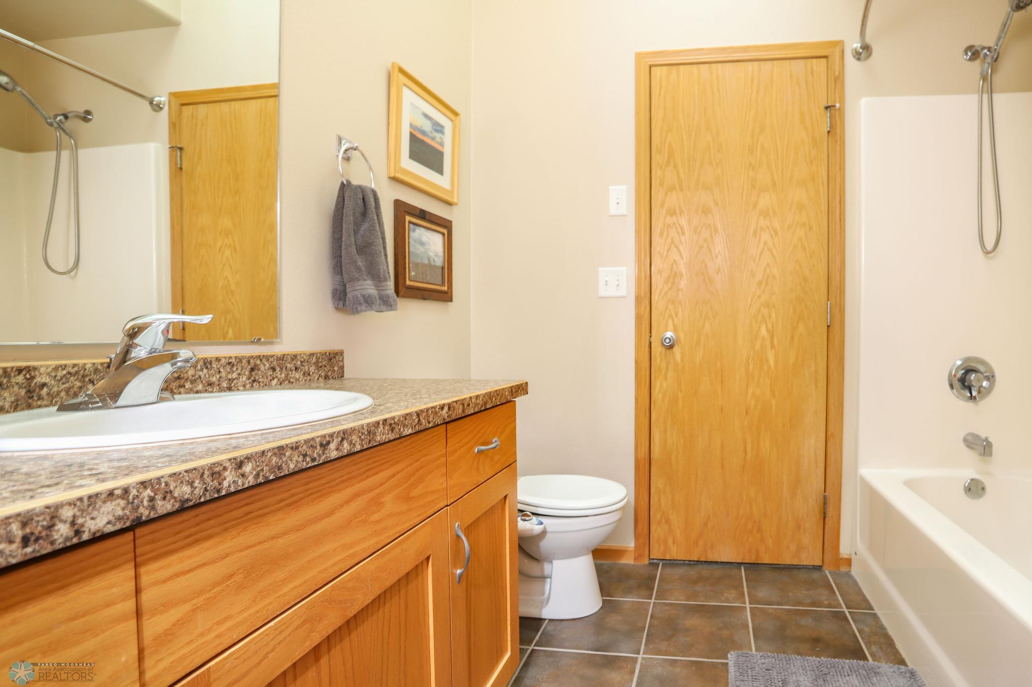Upper Level Bathroom (view 2) with Door to Primary