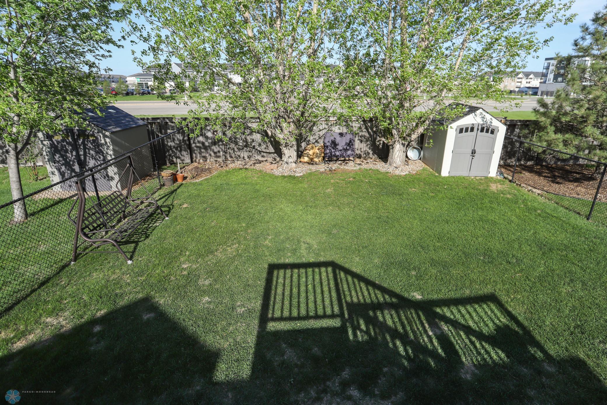 Fully Fenced yard with Mature Trees with Shed