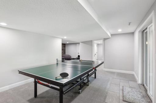 Spacious entertaining area downstairs leading to the walk out patio