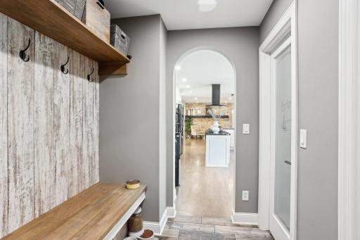 The mud room from the garage also features a sizable pantry