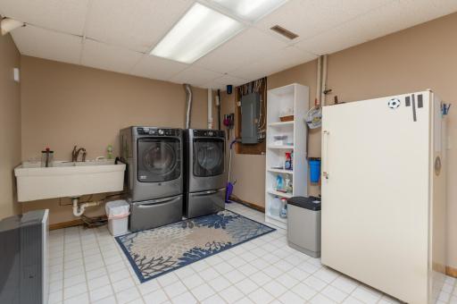 There is a clean, large finished laundry room with storage closet. The home has a water softener and water filter.