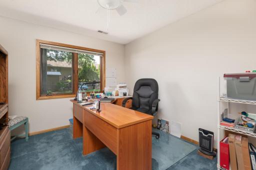 Lower level bedroom or office with lake view and a handy full bath around the corner.