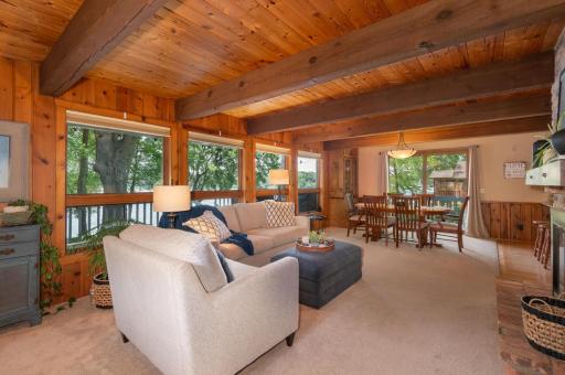 The living area and kitchen view the bay through a full wall of windows. A newer sliding door access the big deck.