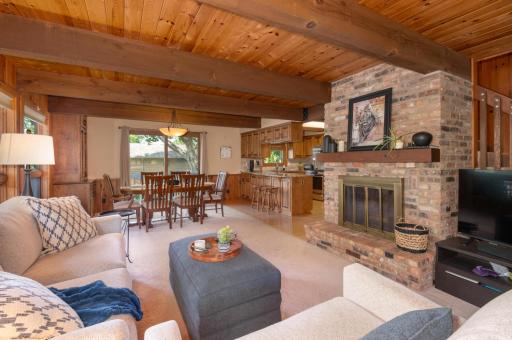 A wood burning brick fireplace with take the chill out on a cool day. The beams and wood ceiling are beautiful.