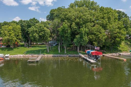 The lot has a slight elevation and it is a very easy walk on the plush lawn to the dock.