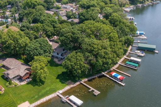 A look at 1749 Avocet Lane with a half acre lot and 130 feet of south facing boulder finished shoreline.