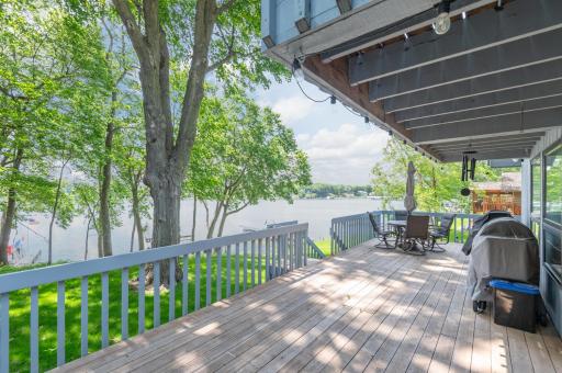 A newer sliding door steps out to the huge south facing deck for entertaining. Enjoy sunny south views of Harrison Bay.