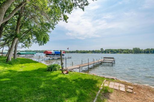 Greet guests as they arrive by boat. There is a nice level area at lakeside for entertaining.