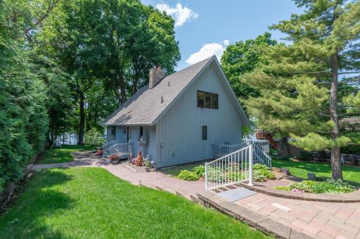 The home rests on a half acre lot and also features a 2 stall garage with loft and 2 stalls below for excellent storage.