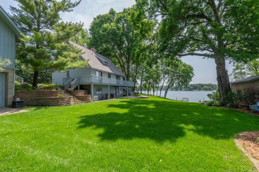 The big yard and beautiful landscaping is outstanding. You will appreciate the quality boulder rip rap shoreline and south facing lake views!