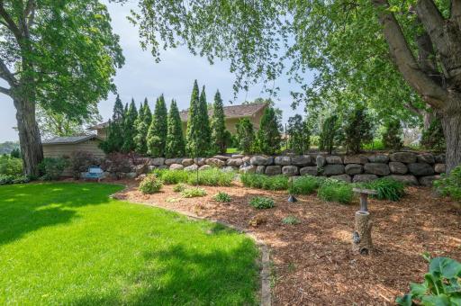 Beautiful landscaping and perennial gardens around the BIG lakeshore lot.