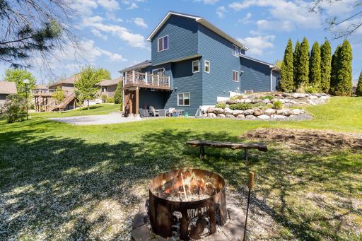 Large Back Yard with amazing landscaping, deck and patio.
