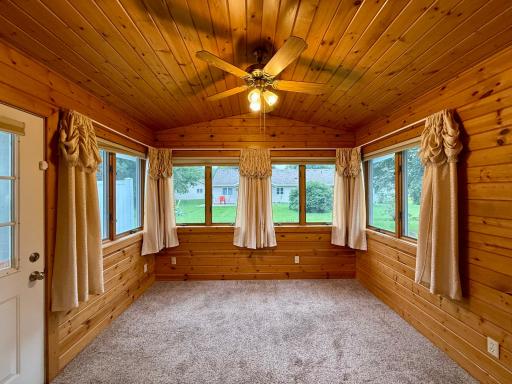 Beautiful Sunroom! Great lighting to bring the outdoors in!