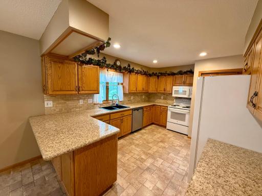 Add a few stools at the counter for additional seating, and visiting with the chef!