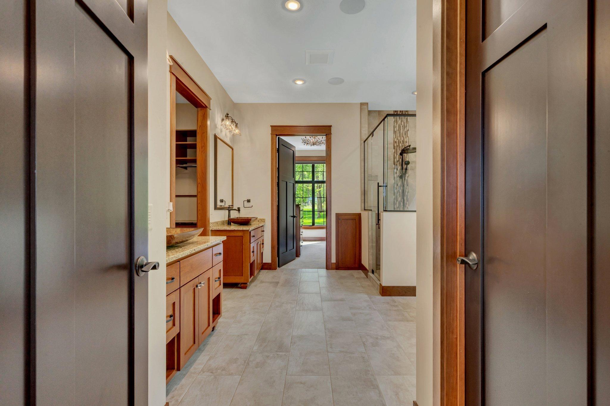 Primary bath designed as a spa-like retreat, featuring luxurious finishes, a soaking tub, and a serene atmosphere for ultimate relaxation.