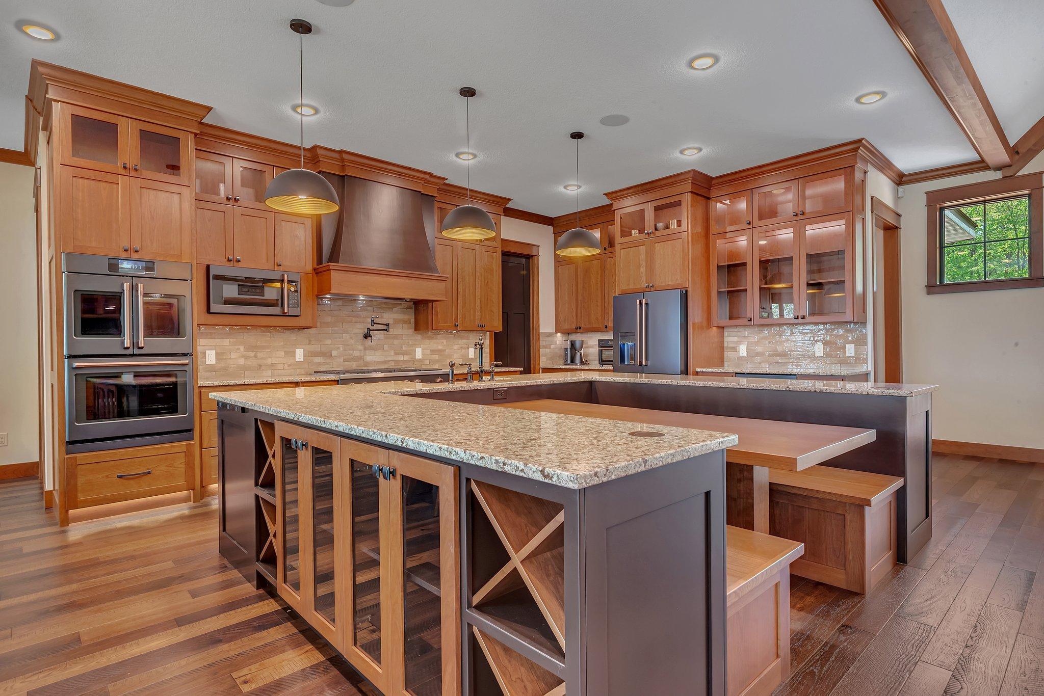 Kitchen center island featuring a built-in wine holder.