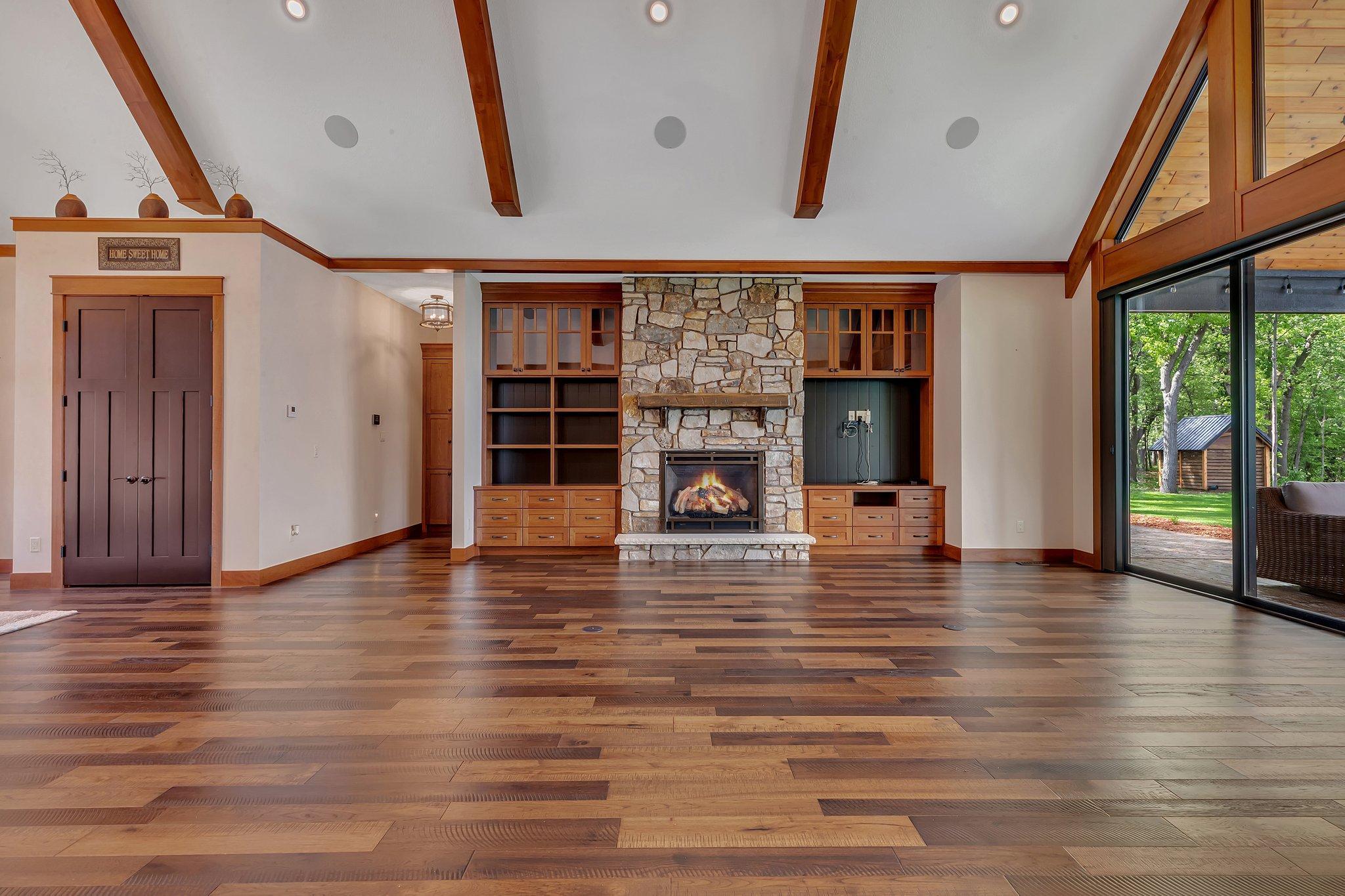 Elegant stone gas fireplace with custom built-ins, adding both warmth and style to the space.