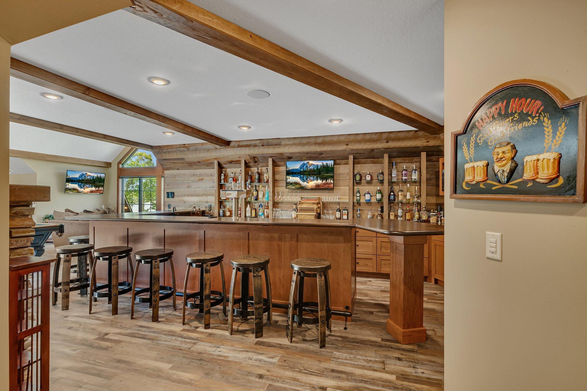 Lounge area offering a polished bar and recreational space for relaxed gatherings.
