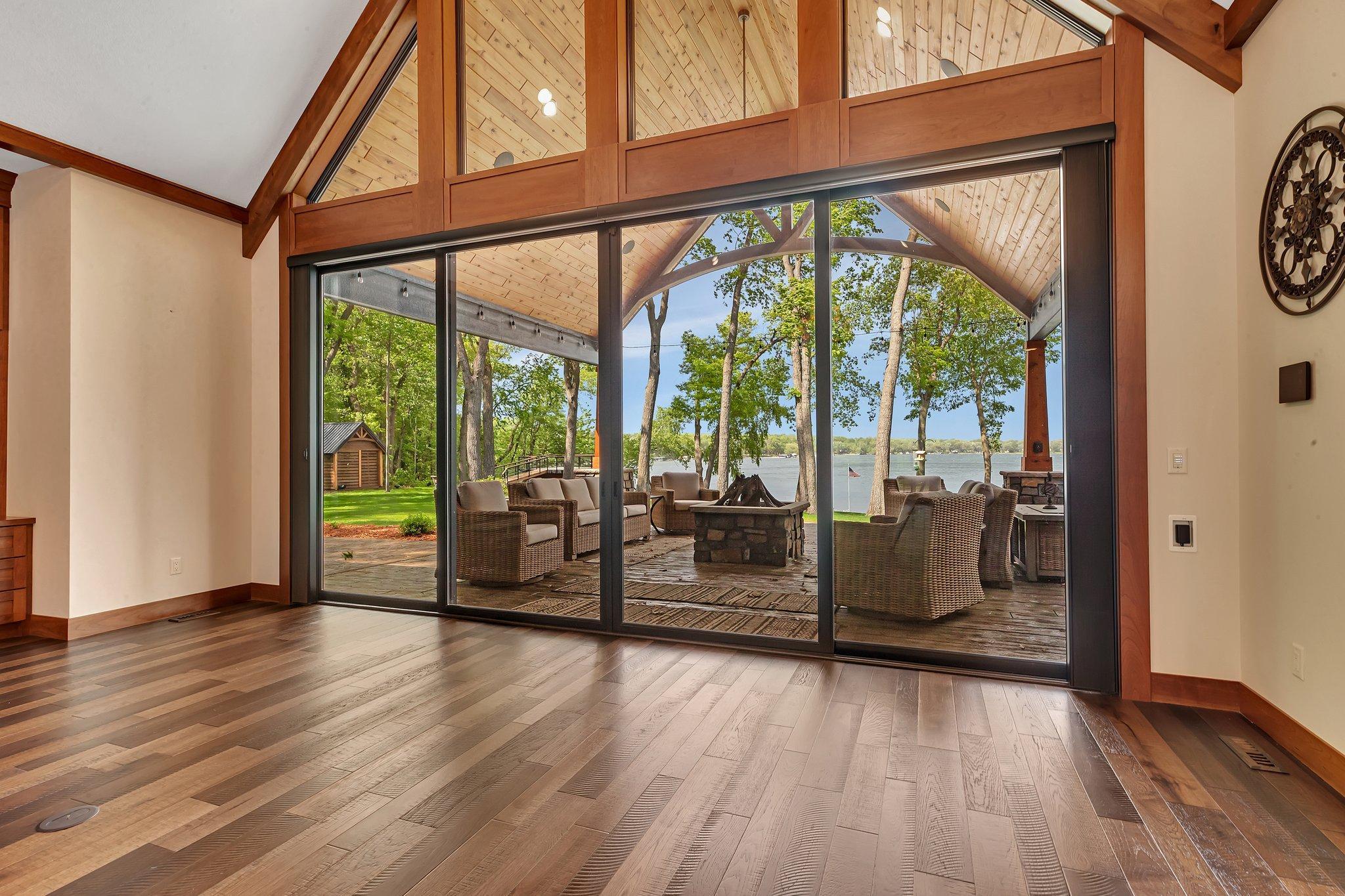 Grand wall of windows offering breathtaking views of Big Fish Lake, bringing the beauty of the outdoors inside.