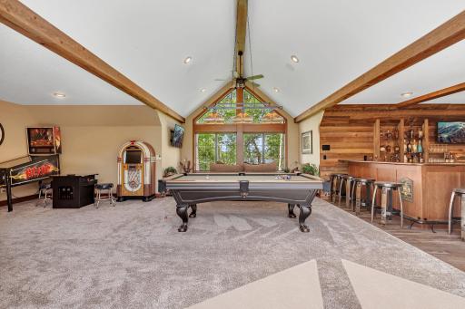 Recreation zone featuring a stylish bar and room for pool, darts, or arcade games.
