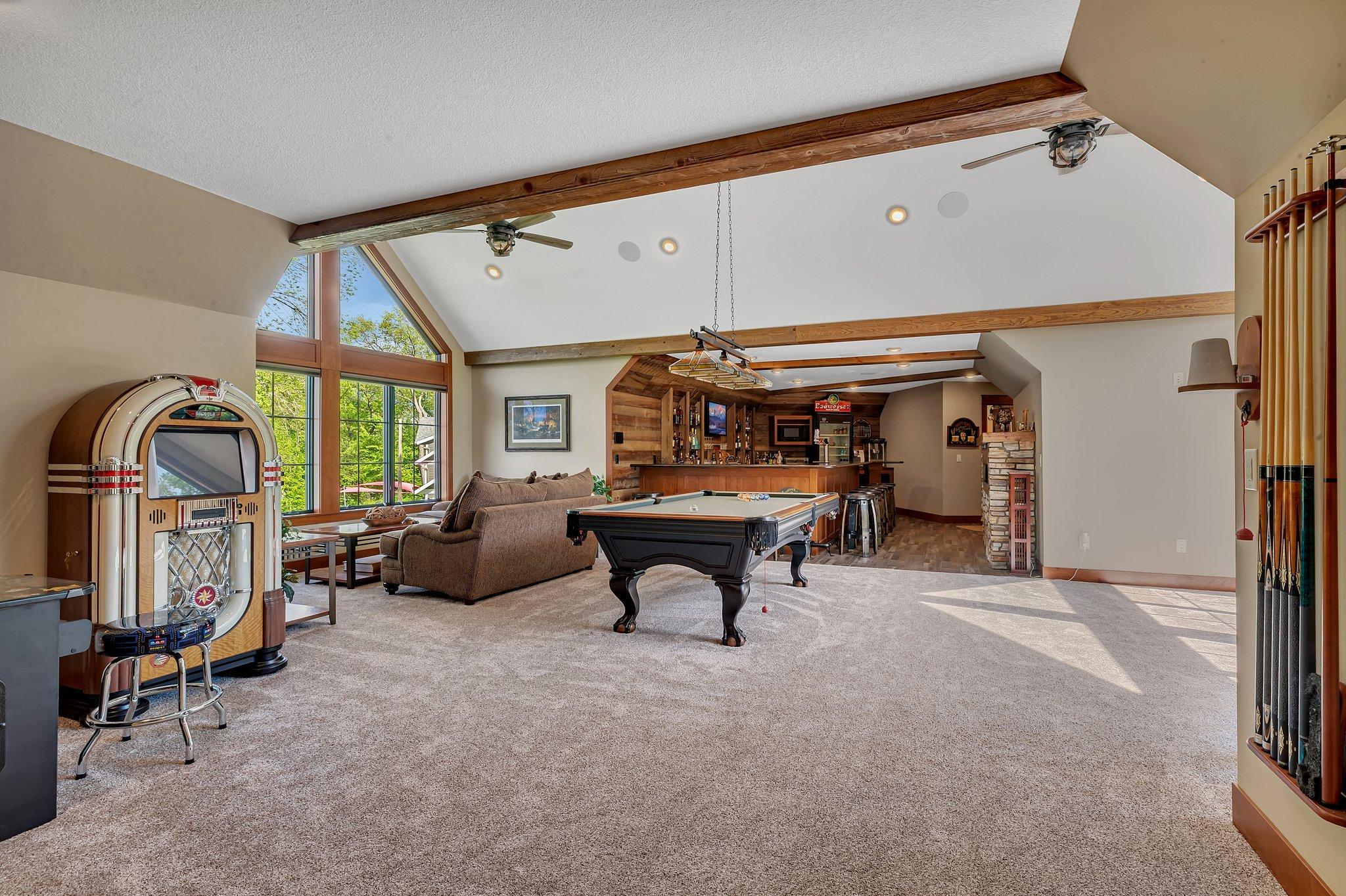 Is all about entertainment with built in bar/fireplace and theatre room, that could easily be converted to additional bedrooms.