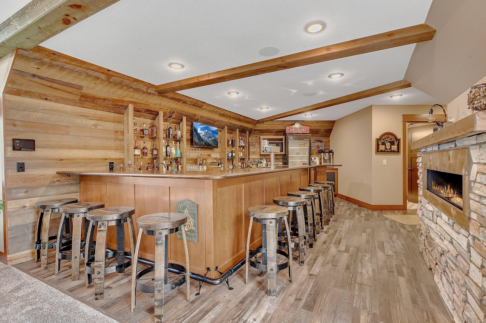 Massive bar area with ample seating, sleek countertops, and plenty of space for entertaining guests in style.
