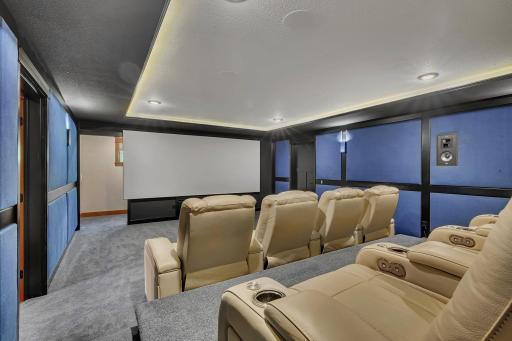 Dedicated theater room with an adjoining sound room, designed for an immersive cinematic experience and optimal audio performance.