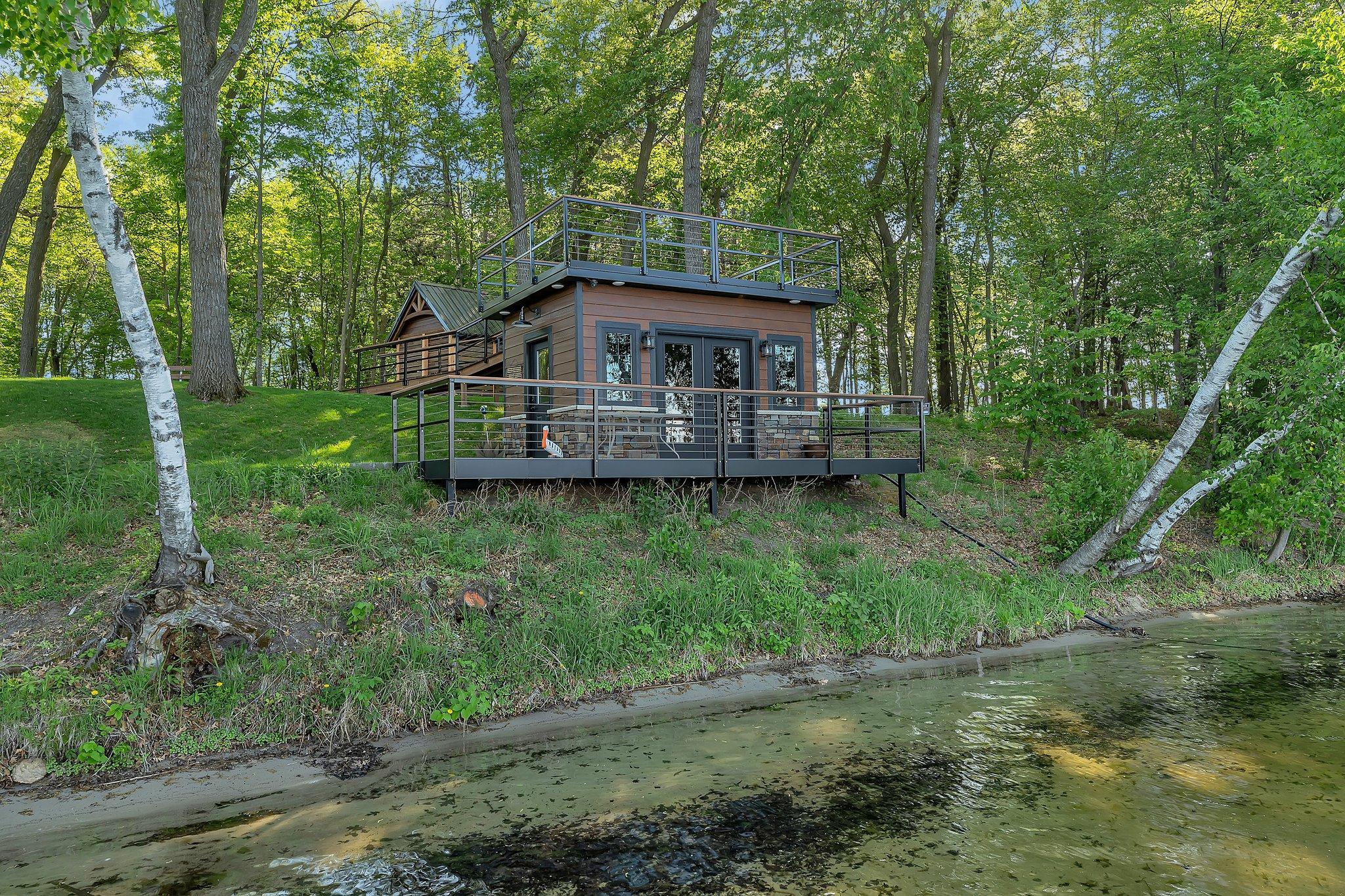 Fish house with a serving line, speakers and seating area.
