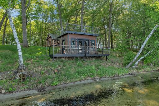 Fish house with a serving line, speakers and seating area.