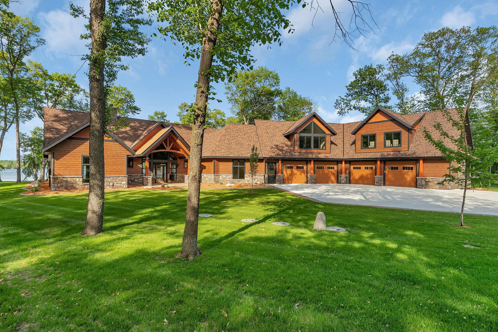 Beautifully designed home set on a meticulously manicured lawn, offering elegance, charm, and exceptional curb appeal.