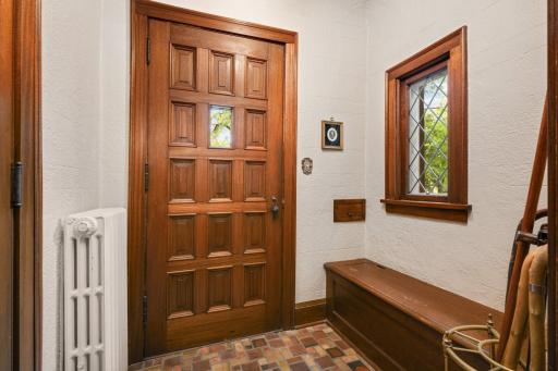 A 4" solid mahogany front door opens to the vestibule